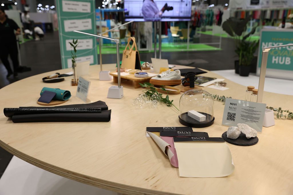 Innovative textile materials and accessories displayed on a round table at Texworld New York.