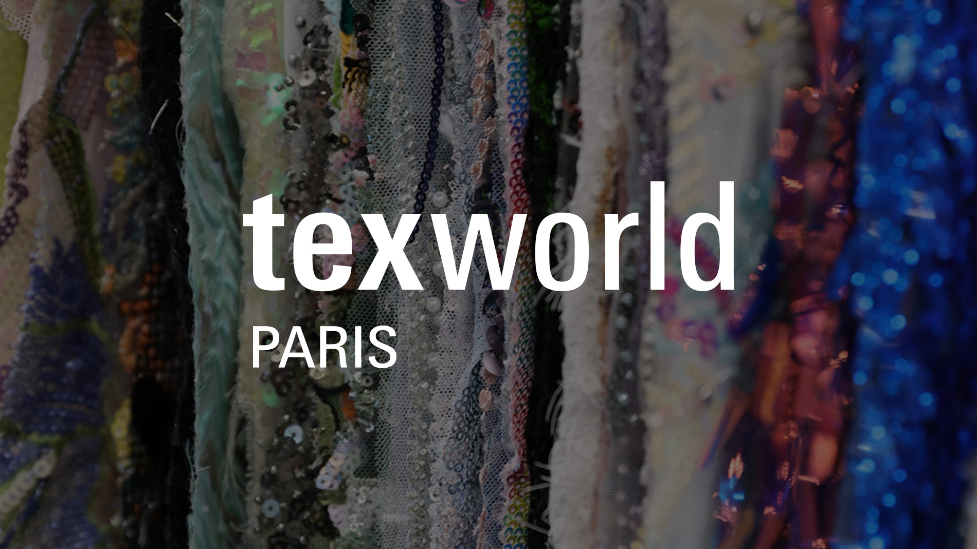 Handbag with intricate patterns showcased at a booth at Texworld New York.